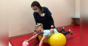 Photo of physical therapy with pediatric patient