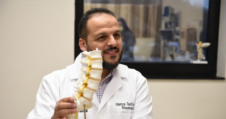 PMC rheumatologist, Dr. Hamza TanToush, consulting with a patient.